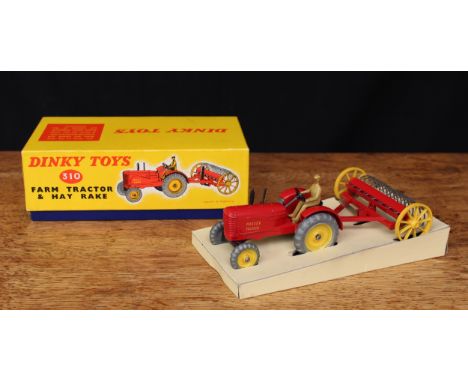 Dinky Toys 310 Massey-Ferguson farm tractor and hay rake, red body with yellow hubs and yellow wheels to hay rake, boxed with