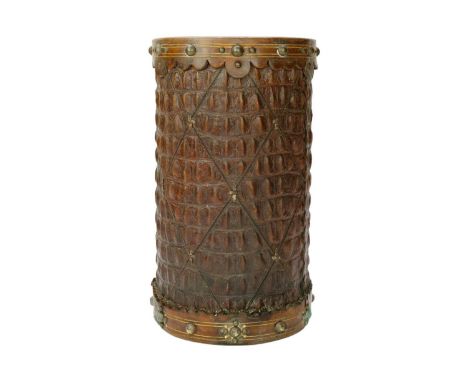 A crocodile skin stick stand with brass mounts. Makers stamp to base, height 37cm.