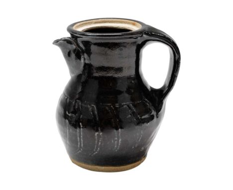 An early St Ives pottery coffee pot With an incised black glaze, impressed personal seal of Bernard Howell Leach lacking cove