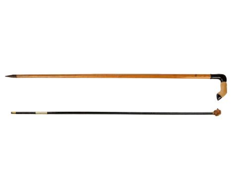 A Luzern taxidermy goat handle walking stick Together with an ebonised walking cane with boxwood carved hen head handle. (2)