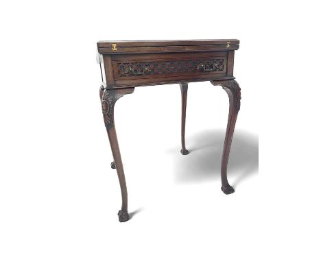 A late Victorian card table The envelope table with good carving and a single drawer. 58cm square and 75cm high