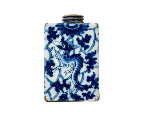 A Delft blue and white square tea caddy. Circa 1760, painted with dragons and trailing flowers in the Kangxi style, height 10