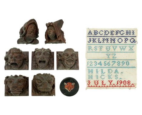 A group of three carved walnut gargoyles. 19th century, with varied expressions, height approximately 8cm, together with a si
