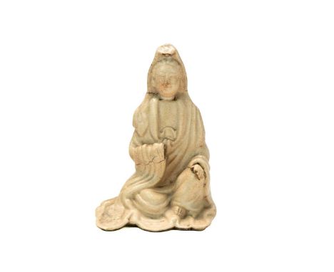 A Chinese pottery figure of seated Guanyin. Probably 16th/17th century, height 12cm.