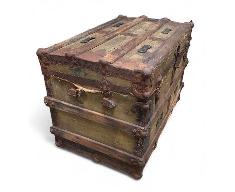 An early 20th century iron bound trunk. Height 59cm width 84cm depth 52cm.