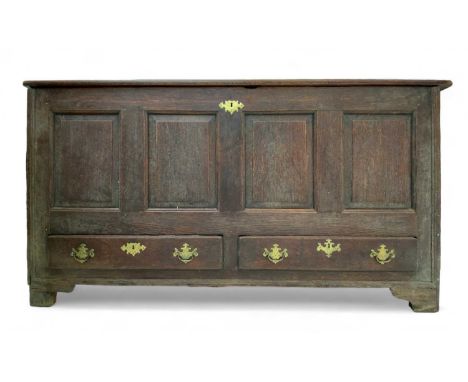 A large, 18th century oak mule chest  With triple plank hinged lid over four panels and two drawers, two panels to sides and 