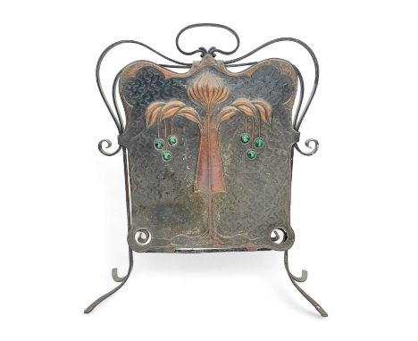 An Arts and Crafts wrought iron and copper fire screen. With inset ceramic cabochons, height 74cm.