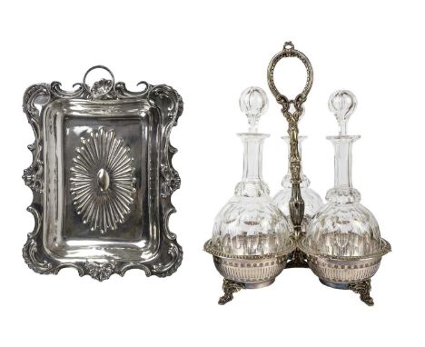 A late Victorian silver plated three section decanter frame. With a cast central handle, and fitted with three shaft and glob