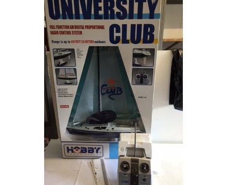 A hobby engine, university club full function radio controlled pond yacht full height 2'9" includes the remote controller.