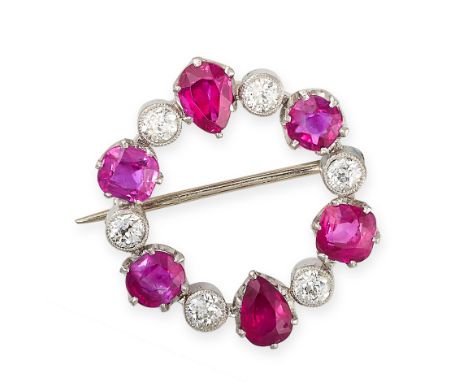 NO RESERVE - A RUBY AND DIAMOND BROOCH Made in platinum, circular design Cushion cut and pear cut rubies, approximate total 1
