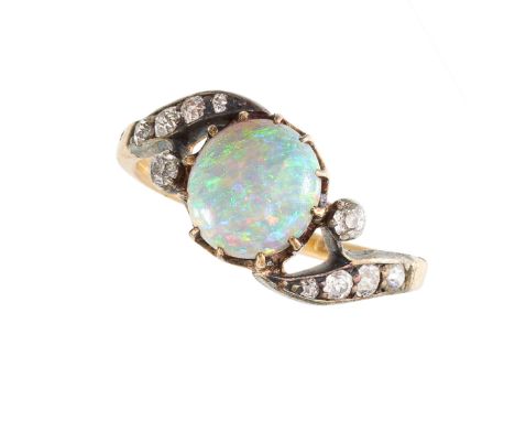 NO RESERVE - AN OPAL AND DIAMOND DRESS RING Made in yellow gold and silver Round cabochon opal Old European cut diamonds Indi