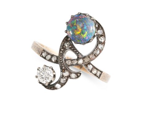 NO RESERVE - A BLACK OPAL AND DIAMOND DRESS RING Made in yellow gold and silver Round cabochon black opal Round brilliant cut