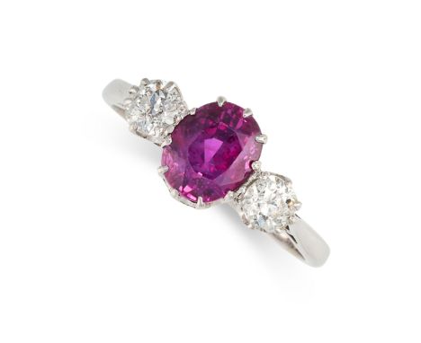 NO RESERVE - A RUBY AND DIAMOND THREE STONE RING, CIRCA 1950 Made in 18 carat white gold and platinum Cushion cut ruby, weigh