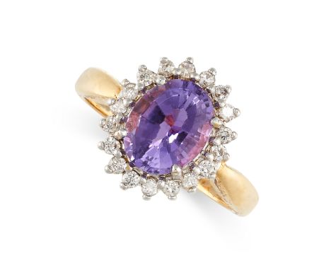 NO RESERVE - AN AMETHYST AND DIAMOND CLUSTER RING Made in 18 carat yellow gold Oval cut amethyst of 1.58 carats Round brillia