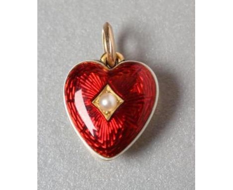 A LATE VICTORIAN HEART CHARM, the scarlet guilloche enamel fascia within black and white enamelled bands, centred by a gypsy 