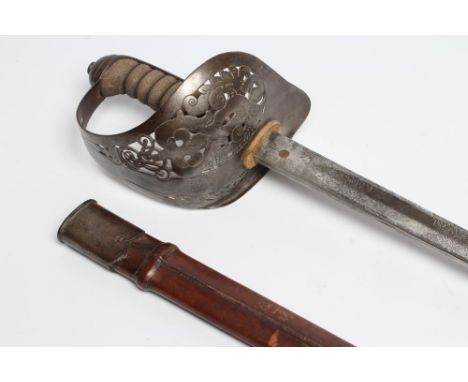 AN 1897 PATTERN OFFICER'S SWORD, the 32 1/2" fullered blade etched with Royal coat of arms amid foliage, hilt of typical form