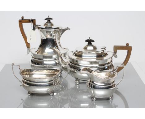 A SILVER FOUR PIECE TEA SERVICE, maker C.S. Harris &amp; Sons Ltd., London 1919 (milk and sugar) and 1920, of rounded oblong 