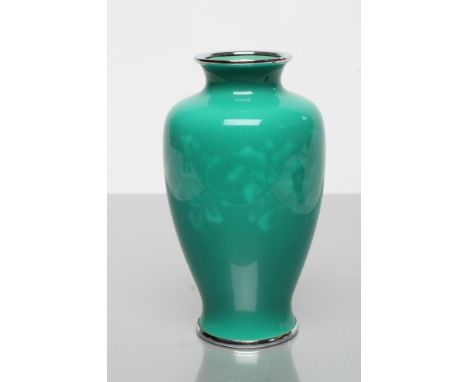 A JAPANESE ENAMEL VASE BY ANDO JUBEI of ovoid form, with a band of pale green flowers on a darker green ground, with unmarked