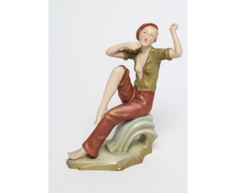 A ROYAL DUX BISQUE PORCELAIN FIGURE, early 20th century, modelled as a young lady wearing a peak cap, open shirt and trousers