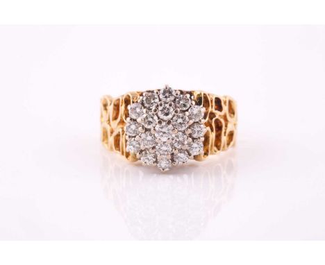 A diamond cluster ring, 1970s, the round brilliant cut diamonds to high settings in white, to a yellow precious metal pierced
