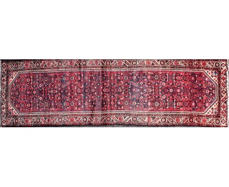 North West Persian blue ground long rug/ carpet runner with all over "Herat" trellis pattern within geometric leaf borders. 4