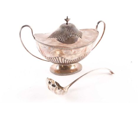 An Edward VII / George V silver punch bowl and ladle, Sheffield 1910 by Mappin &amp; Webb, of twin-handled oval form with ree