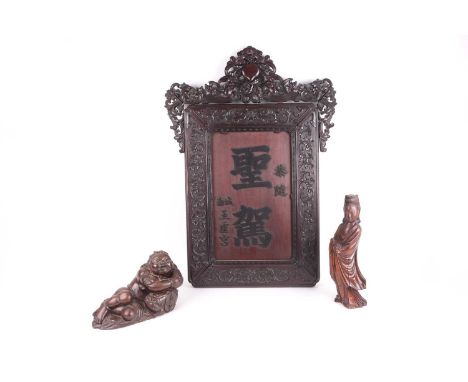 A Chinese Hongmu panel, Qing, late 19th century, the pierced crest carved with a central peach surrounded by bats and scrolli