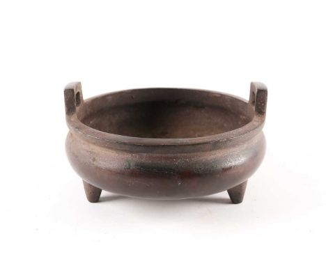 A Chinese brown patinated two-handle tripod censer of compressed circular form, apocryphal Xuande mark to the base, 1053 gram