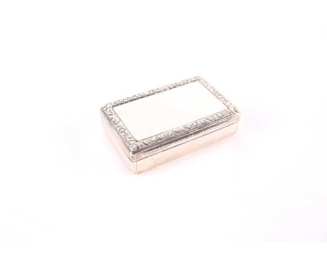A large Victorian silver rectangular snuff box, London 1839 by Thomas Edwards. With a cast and applied floral rim and engine 