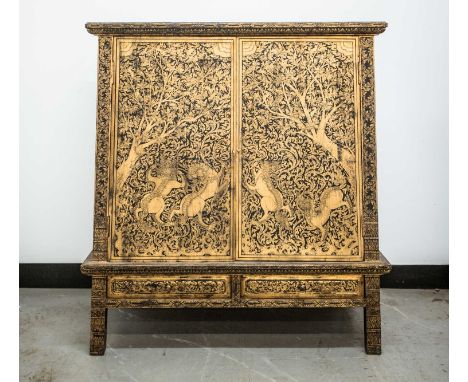 A Tibetan inverted tapering lacquered cabinet, 20th century, with gilt decoration, the cupboard doors and sides painted with 