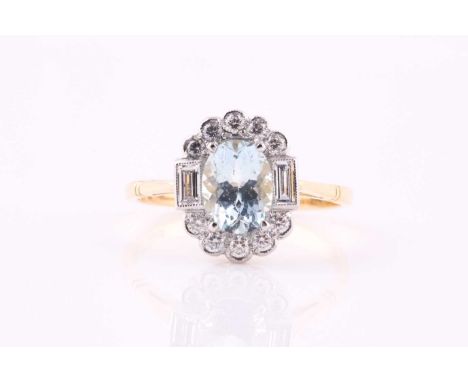 An aquamarine and diamond cluster ring, the 8 x 6mm oval cut aquamarine within a millegrain set surround of baguette and roun