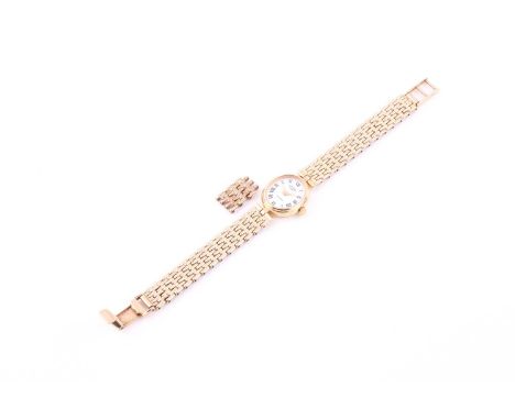 A Ladies wristwatch by Rotary, the oval white dial with Roman numerals, signed, to a 9ct yellow gold gate-link chain bracelet
