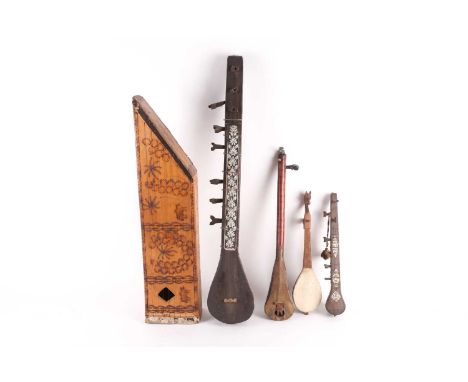 An Afghan Tanbur (Tanboor), 20th century, with inlaid bone decoration, 72.5cm, a Finnish Kantele harp, 20th century, with pok