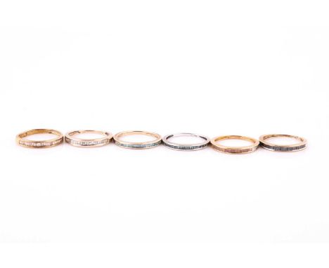 A collection of diamond and coloured diamond ringsEach channel-set to the fron twith baguette-cut diamonds of white, black an