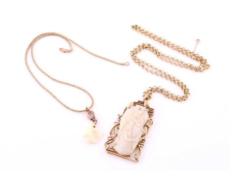 Two opal pendant necklaces, the 9ct yellow gold trace-link chain, stamped with UK hallmark, suspending a carved opal depictin