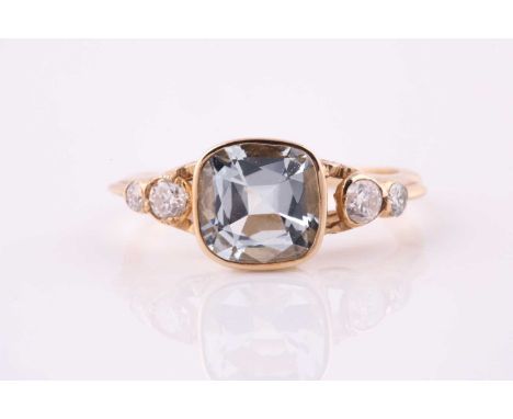 An aquamarine and diamond ring, the square cushion cut aquamarine with two graduated round cut diamonds to each shoulder, all