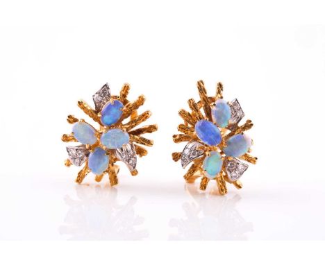 A pair of opal and diamond earringsEach starbust with textured spikes, claw-set with oval-shaped opal cabochon and highlighte