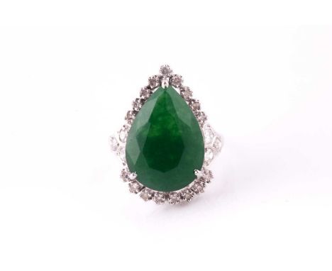 A cluster ring, the pear shape dyed green beryl within a surround of round brilliant cut diamonds, with eight-cut diamond clu