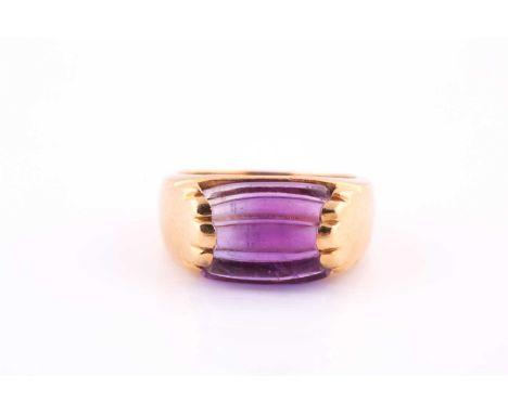 An amethyst ring by BvlgariThe reeded and polished amethyst to a polished 18ct yellow gold mount, stamped with hallmark, sign
