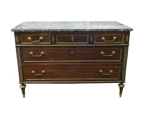 A French empire period 'Directoire' marble-topped mahogany commode, fitted three short over two long drawers with brass inlay