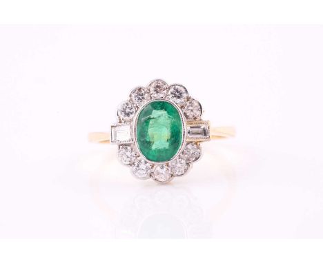 An emerald and diamond cluster ring, the 8 x 6mm oval cut emerald with millegrain set round brilliant and baguette cut diamon