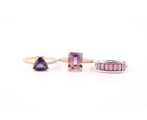 Three gem-set ringsEach set with vari-cut gems such as ametrine, pink sapphire and tanzanite, mounted in 9 and 18ct gold, sta