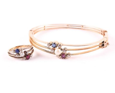 A sapphire, ruby and pearl ring and hinged bangle suite, set to the front with three knife-edge bars alternately set with old