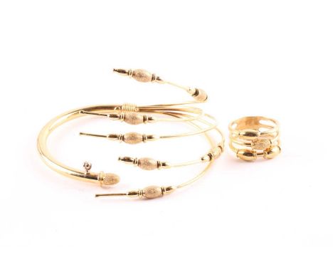 A bangle and ring suiteThe bangle to one side with five bars sporadicaly set with brushed metal beads, together with a ring e