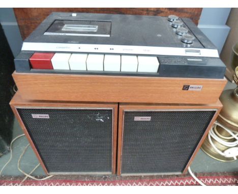 A vintage Phillips stereo cassette recorder, with a pair of Phillips speakers

