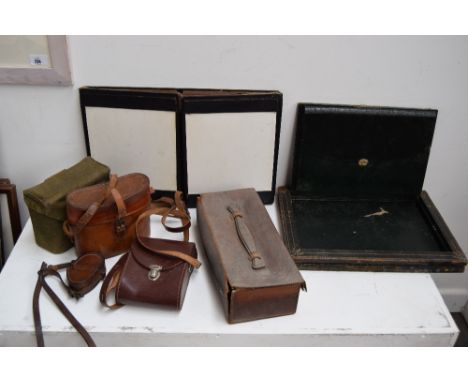 A wartime canvas binocular case, leather compass case, folding writing case and other items (7)
