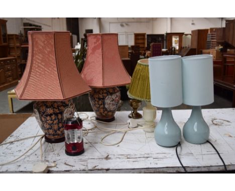 A qauntity of various lamps including two oriental style lamps with peach shades, an onyx lamp, a small gas lamp and a portab
