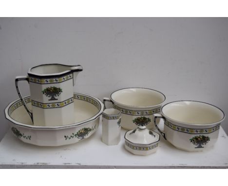 A Royal Doulton wash jug and bowl, tooth mug, two chamber pots and a soap dish and cover decorated with an Art Deco floral de