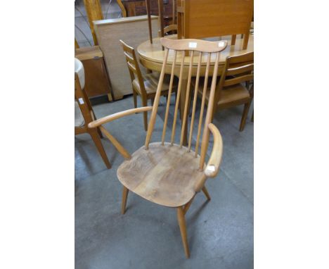 An Ercol Blonde elm and beech Goldsmith elbow chair 