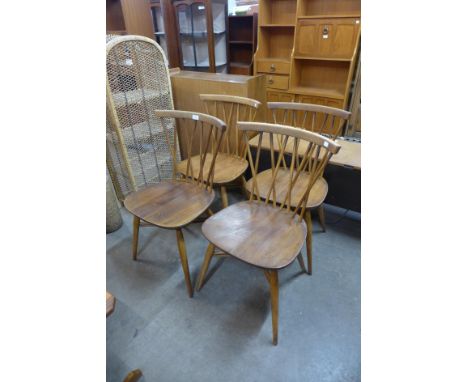 A set of four Ercol Blonde elm and beech 376 model candlestick chairs 